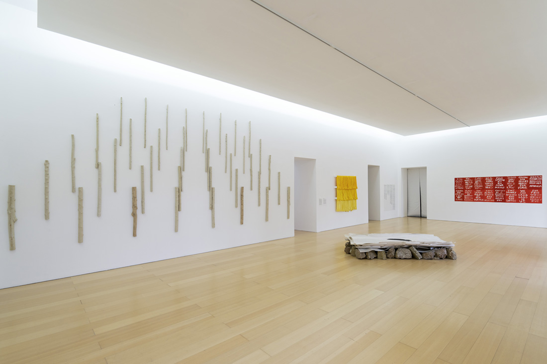 installation view: Rethinking Nature, Museo Madre, Naples, showing wall left to right: Yasmin Smith, Edgar Heap of Birds; floor: Ivano Troisi