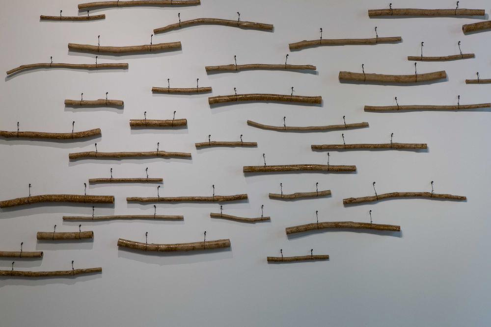 detail of ceramic Eucalyptus branches: Yong Chuan slip with flooded gum wood ash glaze | Yasmin Smith - Flooded Rose Red Basin | installation view Cosmopolis #1.5 - Enlarged Intelligence, Mao Jihong Arts Foundation, Chengdu, China