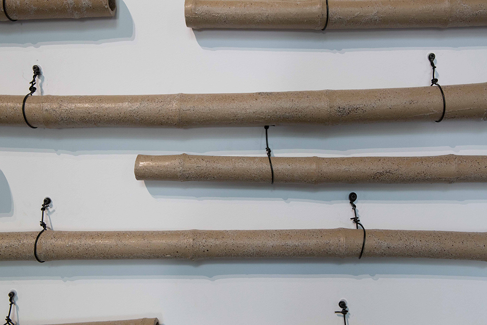 detail of ceramic bamboo poles: Yong Chuan slip with Jiajiang bamboo ash glaze | Yasmin Smith - Flooded Rose Red Basin | installation view Cosmopolis #1.5 - Enlarged Intelligence, Mao Jihong Arts Foundation, Chengdu, China
