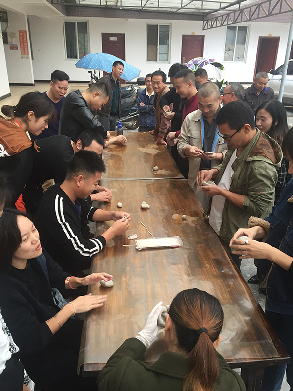 Factory workers making pinch cups for Flooded Rose Red Basin - Jinhui Ceramic Sanitary Ware Factory near Wuchangzhen, Sichuan Province, China