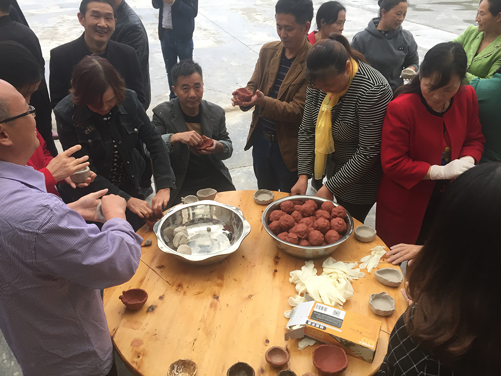 Factory workers making pinch cups for Flooded Rose Red Basin - Jinhui Ceramic Sanitary Ware Factory near Wuchangzhen, Sichuan Province, China