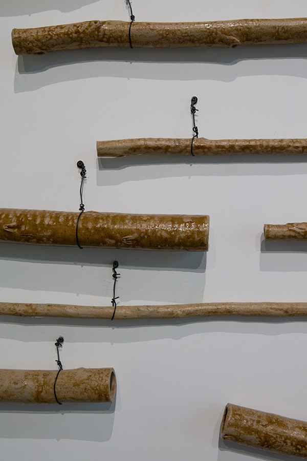 detail of ceramic Eucalyptus branches: Yong Chuan slip with flooded gum wood ash glaze | Yasmin Smith - Flooded Rose Red Basin | installation view Cosmopolis #1.5 - Enlarged Intelligence, Mao Jihong Arts Foundation, Chengdu, China