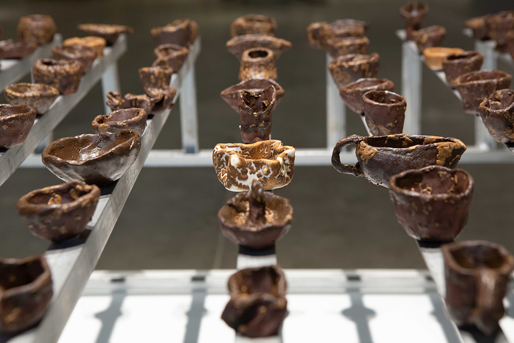 detail of pinch cups: Meishan Tudi red clay and Jingdezhen porcelain with Sichuan green tea wood ash glaze | Yasmin Smith - Flooded Rose Red Basin | Cosmopolis #1.5 - Enlarged Intelligence, Mao Jihong Arts Foundation, Chengdu, China